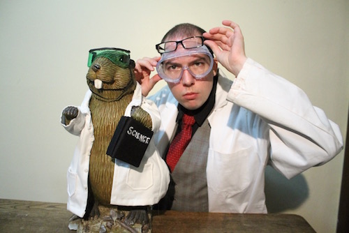 Photo of Kyle Allatt and a beaver doing science