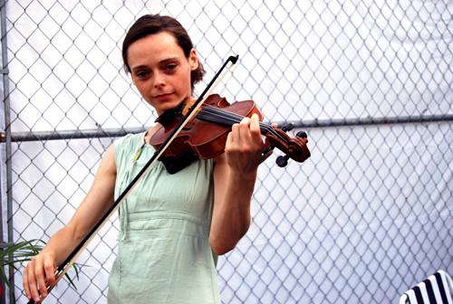 photo of woman playing violin