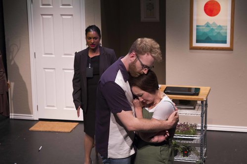 Wayne and Akeena console each other while Hilda speaks to them.