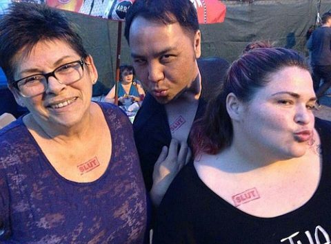 Photo of Sam Mooney, Wayne Leung and Megan Mooney with 'slut' tattoos by Erin Norah