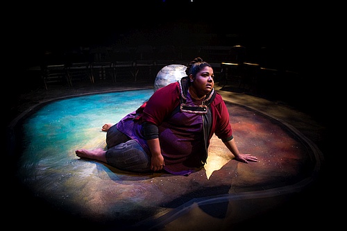 Photo of woman sitting on the floor looking up - Yolanda Bonnell in bug