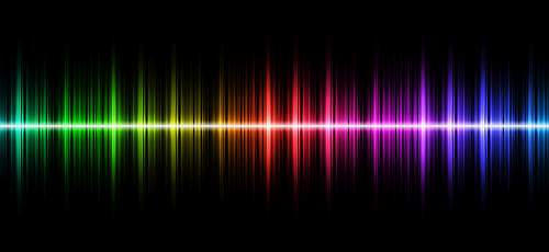 image of a rainbow coloured soundwave on a black background